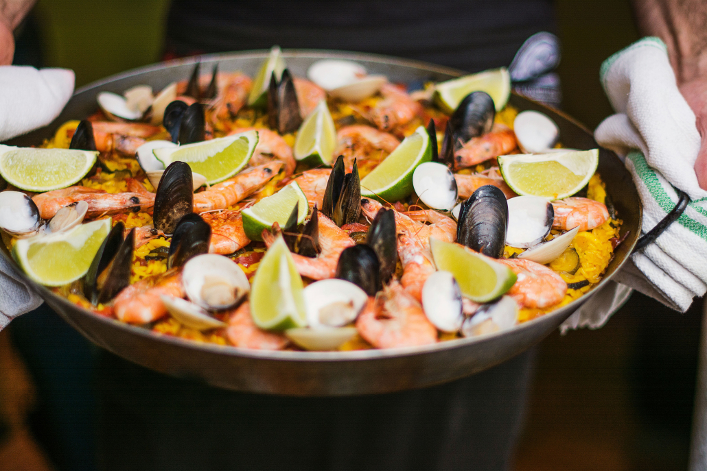 Homemade seafood paellas accompanying barrel tastings