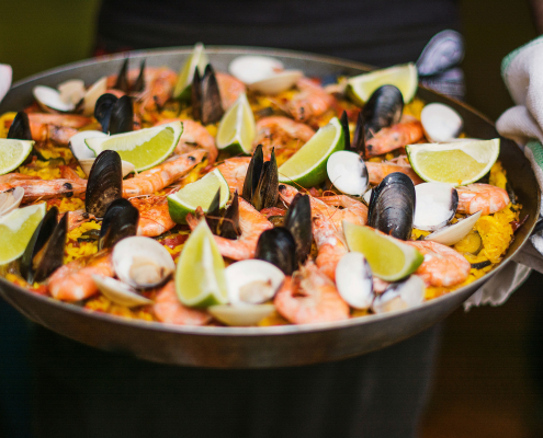 Homemade seafood paellas accompanying barrel tastings